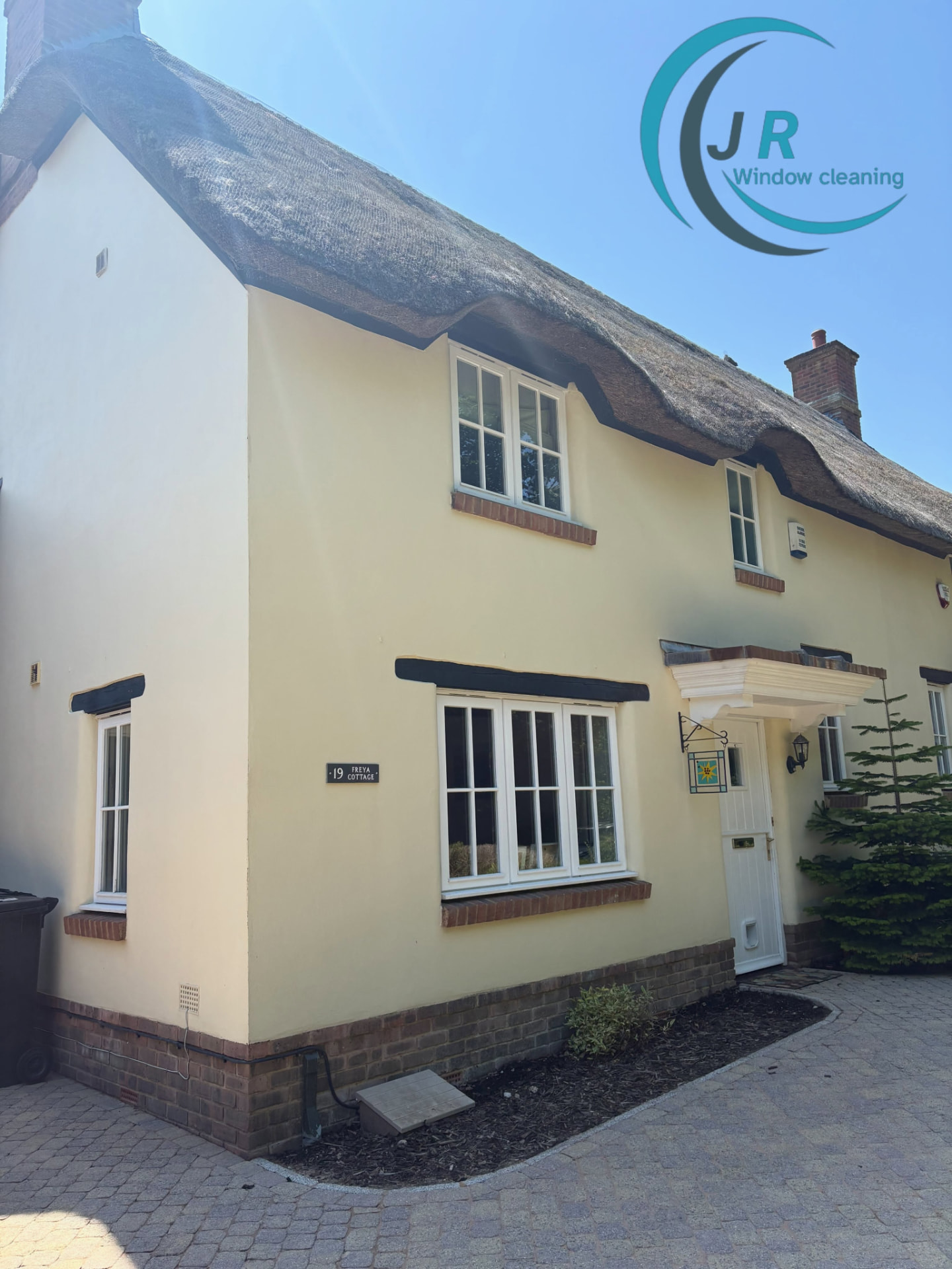 Freshly cleaned windows and soft washed render on a Dorset cottage